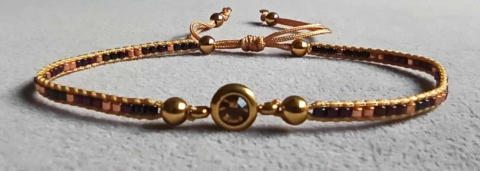 Minimalistyczna bransoletka tkana z oczkiem Rose Secrets różowa Minimalistyczna bransoletka tkana z oczkiem Rose Secrets różowa