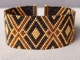 szeroka bransoletka tkana z koralików w kolorze brązu i złota
